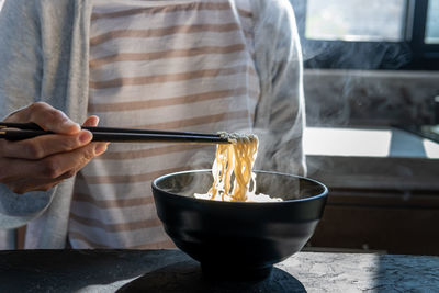 Midsection of man preparing food on table