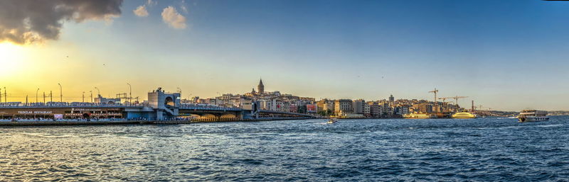 View of buildings in city at sunset