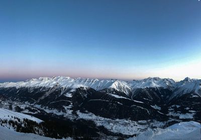 Scenic view of snowcapped mountains against clear sky