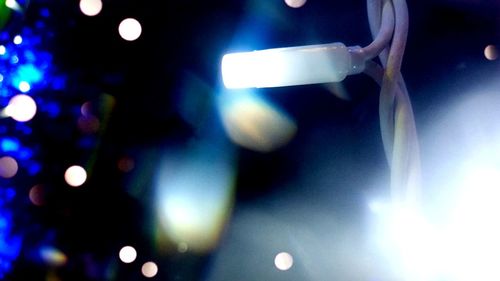 Low angle view of illuminated lighting equipment