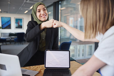 Smiling women in office