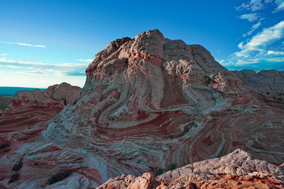 Rock formations on mountain against sky