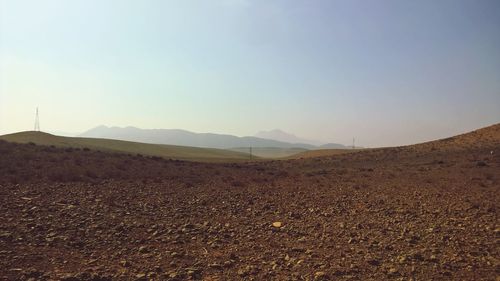 Scenic view of arid landscape against clear sky