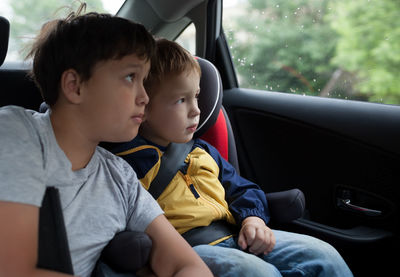 Boys sitting in car