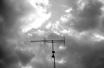 Low angle view of silhouette street light against sky