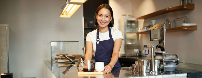 Portrait of young woman working at home