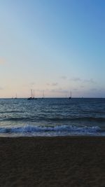 View of calm sea against blue sky