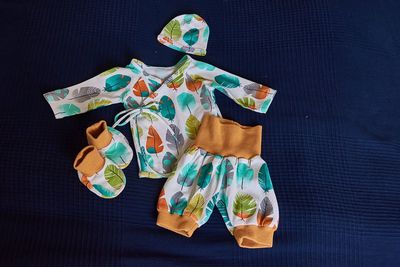 High angle view of baby clothing on table