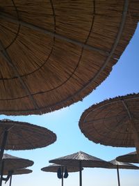 Low angle view of parasol against sky