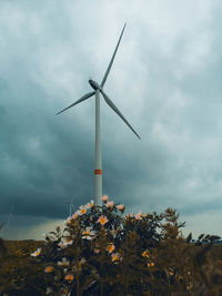 Low angle view of windmill against sky