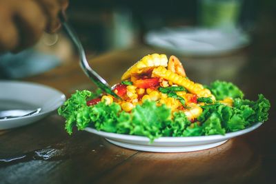 Close-up of salad served in plate on table