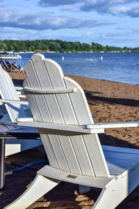 Adirondack chairs on the beach