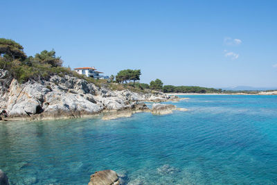 Scenic view of sea against blue sky