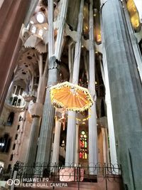 Low angle view of illuminated lanterns hanging at night