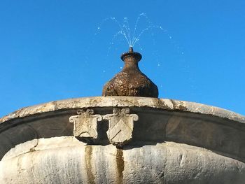 Low angle view of built structure against blue sky