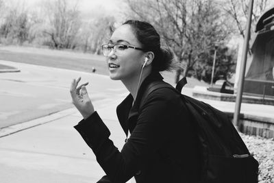 Young woman smoking on snow