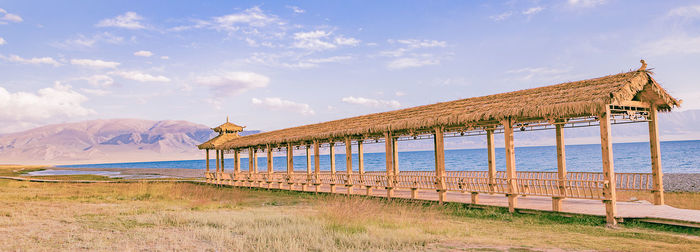 Lifeguard hut on beach against sky