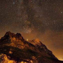 Low angle view of mountain against sky at night