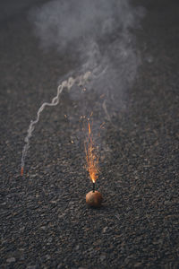 Close-up of burning candles on leaf