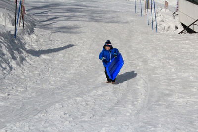 High angle view of young woman in snow