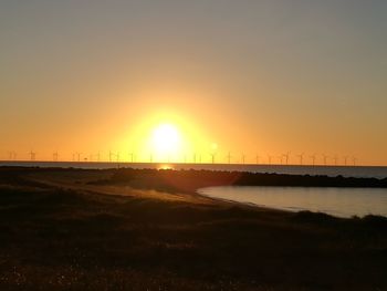 View of beach at sunset