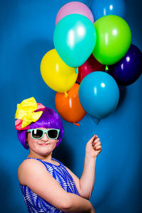 Portrait of a girl with colorful balloons