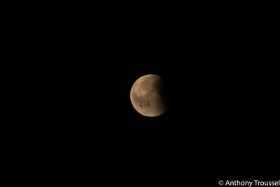 Low angle view of moon against sky at night