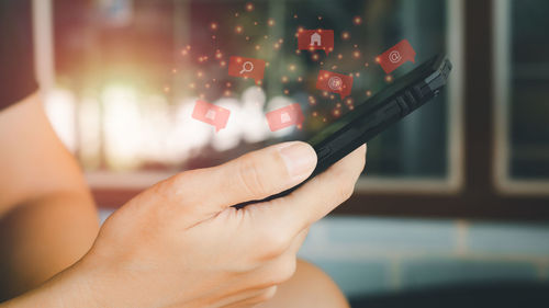 Close-up of woman hand using smart phone