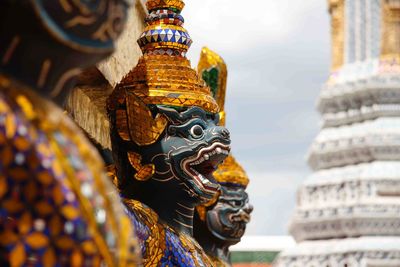 Close-up of statue against temple