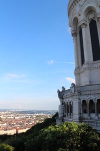 Low angle view of building against blue sky