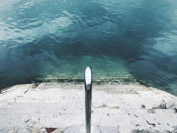 High angle view of bird swimming in lake