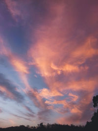 Low angle view of dramatic sky during sunset