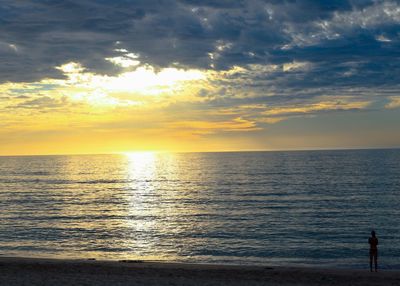 Scenic view of sea against sky at sunset