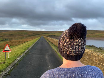 Rear view of woman wearing a knit hat