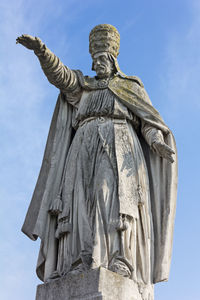 Low angle view of statue against sky