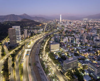 High angle view of illuminated cityscape against sky