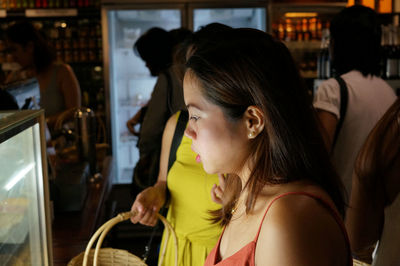 People shopping at market store