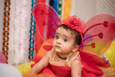 Cute girl in fairy costume at home