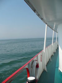 Cropped boat in sea against clear sky