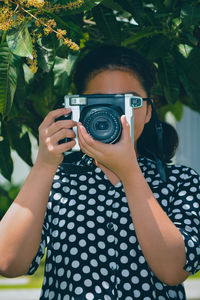 Portrait of man photographing camera