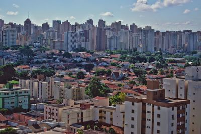 High angle view of buildings in city against sky