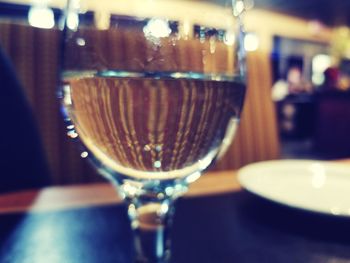 Close-up of wine in glass on table