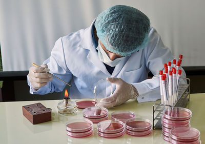 Midsection of man working on table