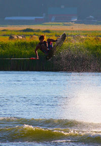 Woman jumping in water