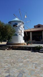 Traditional windmill against clear blue sky