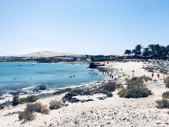 Scenic view of beach against clear sky