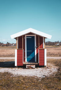 Wooden hut at skanör beach against clear sky.