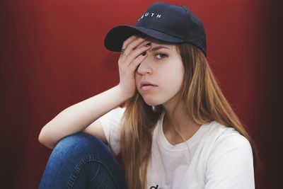 Close-up of young woman wearing hat