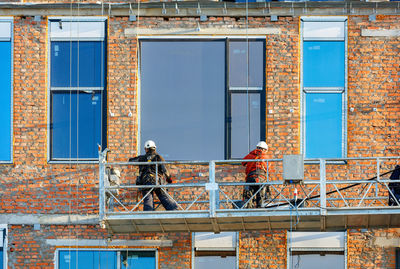 Low angle view of construction site against building