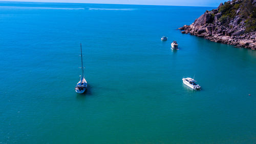 High angle view of people on sea against clear sky